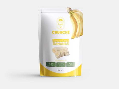 A stand-up pouch of Earth Recipes Crunchz freeze-dried bananas with a white and yellow design, showcasing banana illustrations. Labels display 'No Sugar Added,' 'Healthy Snack,' and 'No Additives.